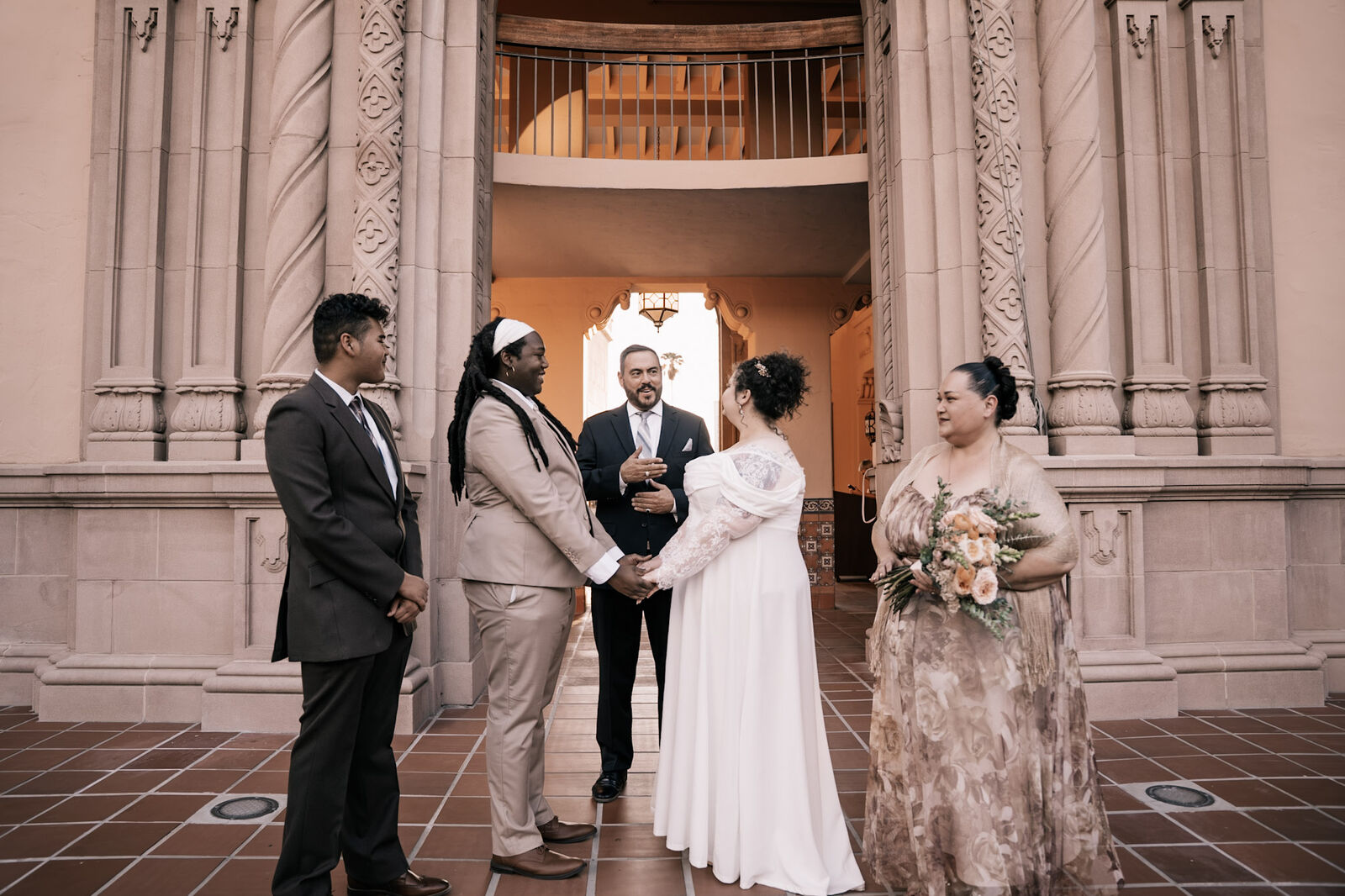 Vows beneath the carved stone arches of the Pima County Courthouse