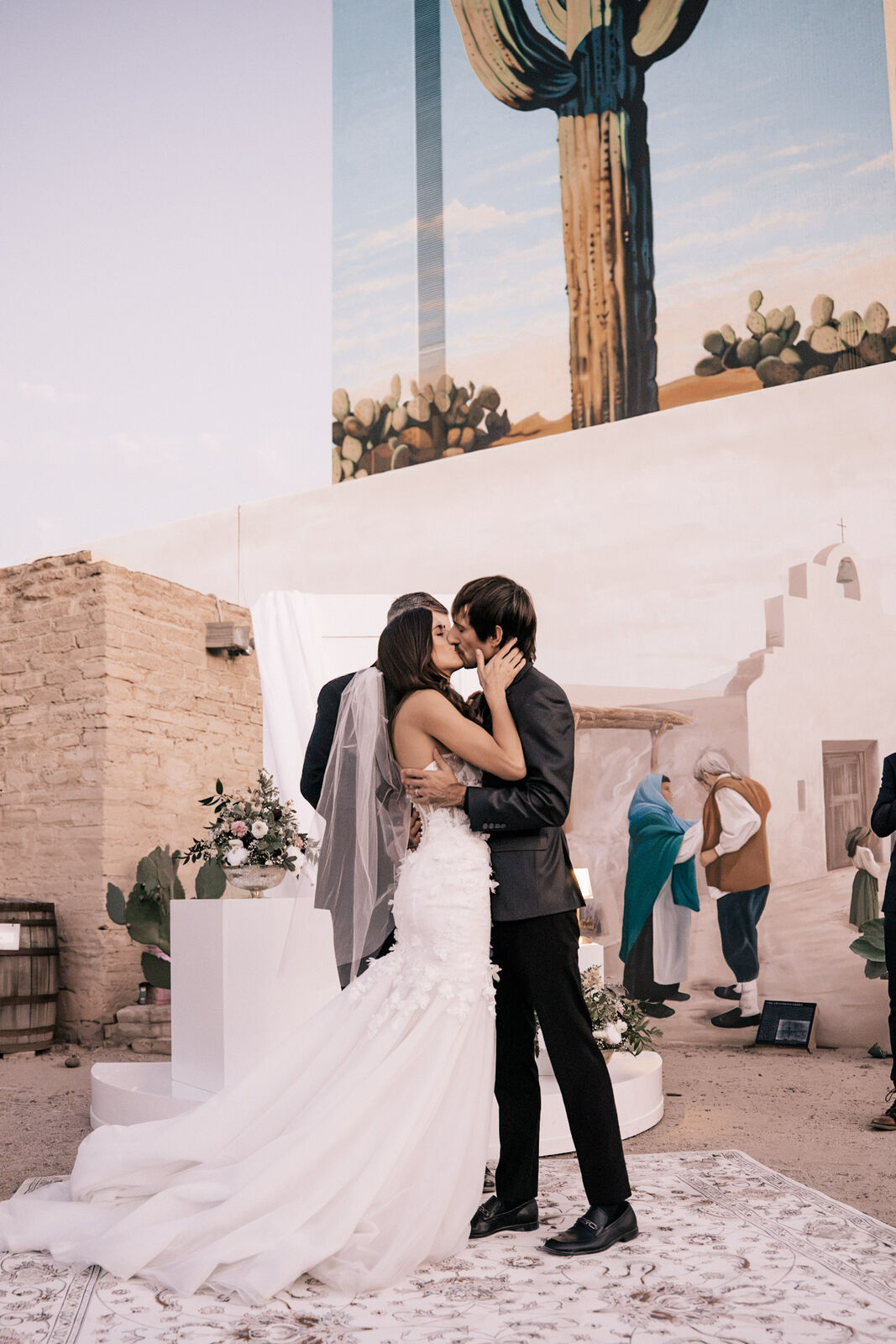 The first kiss in front of the painted desert mural