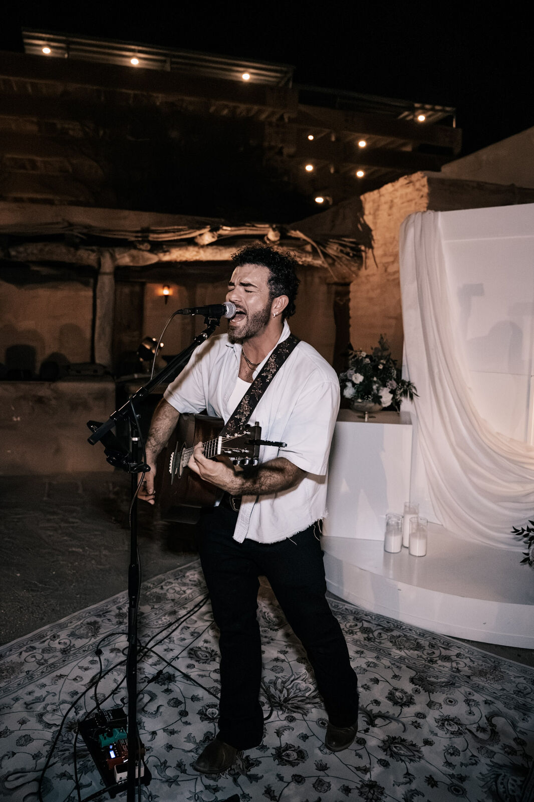A singer with an acoustic guitar during the reception
